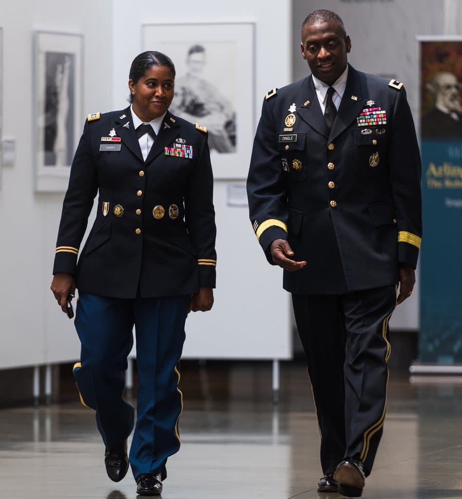 Kim Short in Army dress uniform walking with a senior Army officer